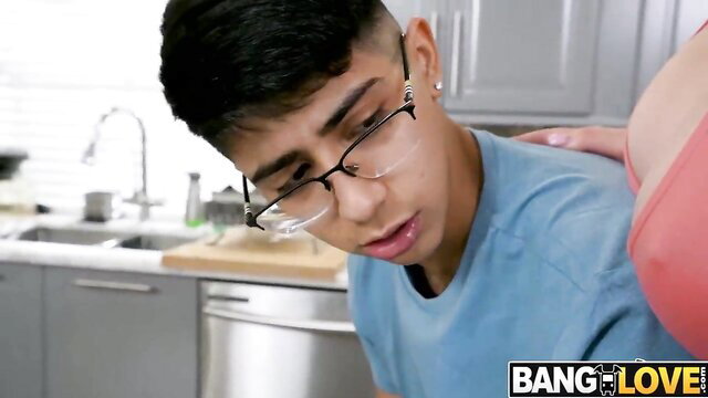 Glasses-wearing Arab twink kissed by busty MILF in kitchen tease