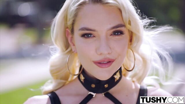 Blonde bombshell Kenna James in sexy choker lingerie, seductive gaze