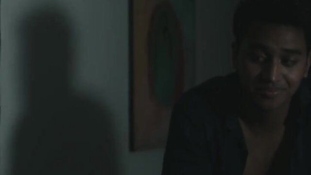 Hershie De Leon closeup in shadowy steamy scene