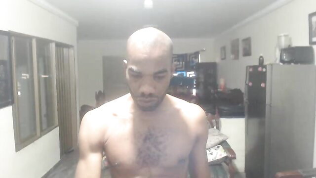 Bald Black muscular man shirtless in webcam show