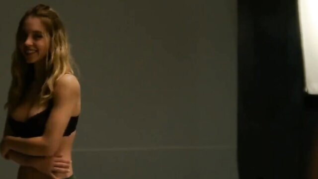 Sydney Sweeney topless blonde in black bra, smiling seductively