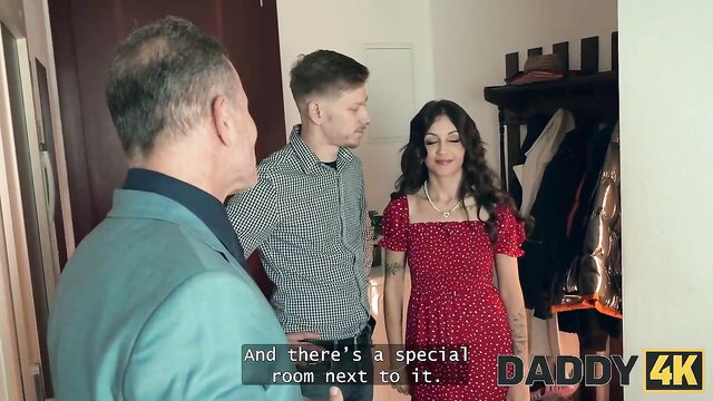 Liz Ocean in red polka dot dress with two men in Daddy 4K hotel scene