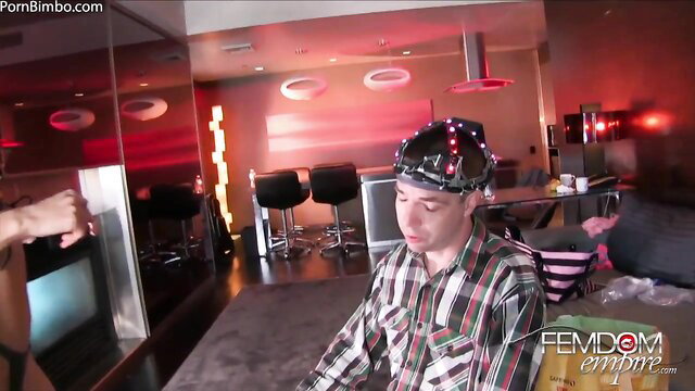 Riley Reid fits LED femdom headset on man in chastity sissy training