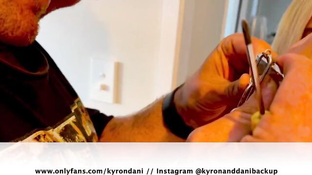 Kyron applying eyelash curler intimately to blonde Dani's eye closeup