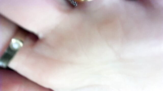 Anne ASMR closeup hand with gold rings, soft pink skin satisfying touch