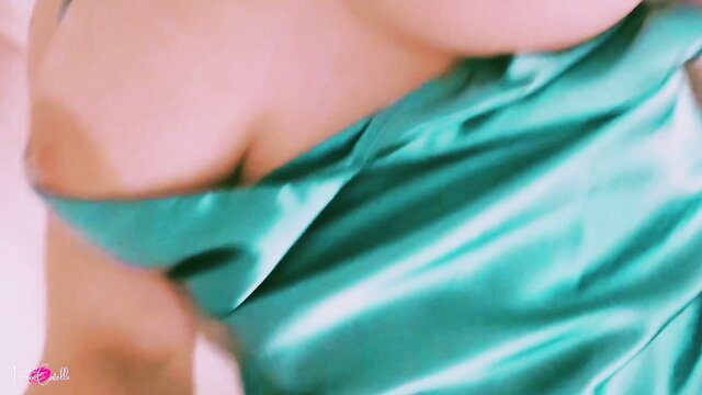 Fiona newbie in teal satin dress slipping off shoulder, teasing cleavage