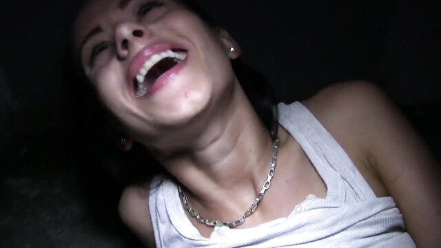 Tina Walker laughing with head back, tank top, necklace