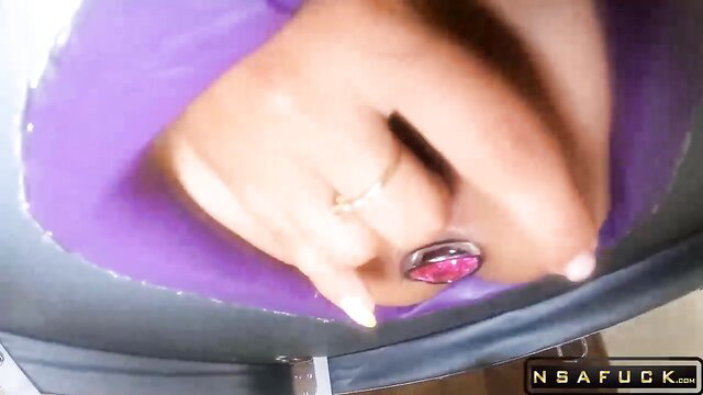 Amateur ebony babe's hand near shaved pussy in purple lingerie closeup