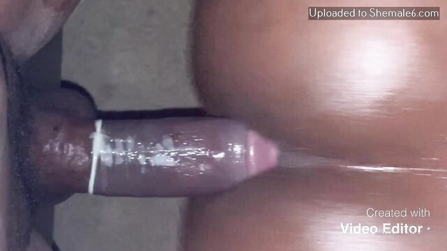 Edible Ciara's thick ebony shemale cock between big brown ass cheeks