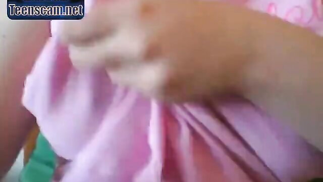 Chubby blonde teen in pink dress lifts skirt exposing shaved pussy closeup