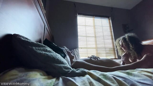 Curly-haired stepmom fondles stepson on bed in hot taboo preview