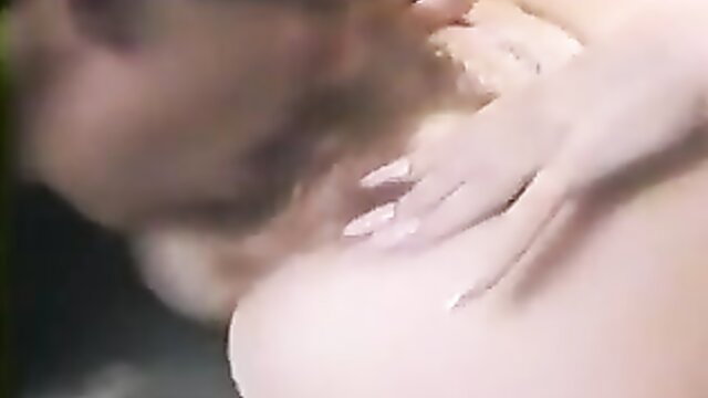 Classic Seduction blonde with big tits groped by man closeup