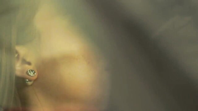 Jill Kassidy closeup with sparkling earrings, luxury wife tease