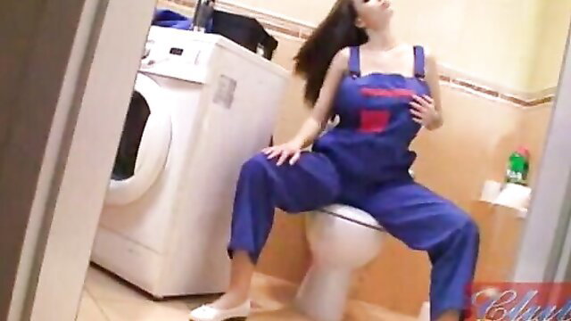 Dominno in blue overalls flashing huge tits on toilet in CLUB DOMINNO repairer