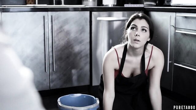 Valentina Nappi kneeling in a kitchen