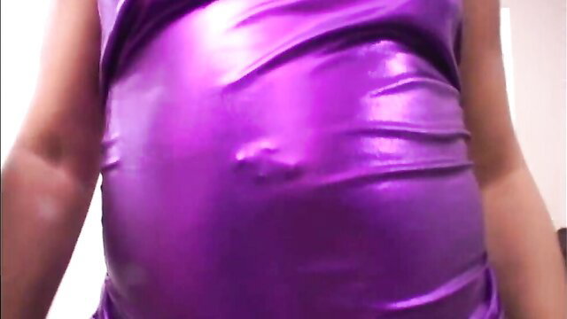 Shiny purple latex on curvy ebony MILF's huge belly and ass
