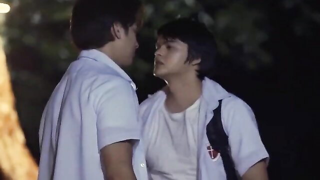 Filipino hunk in school uniform kissed by muscular guy outdoors POV