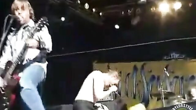 Rock singer with guitar penetrates fan girl up close at live show