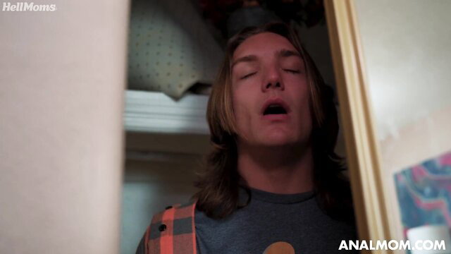 Stepson with long hair peeking from closet in busty MILF threesome