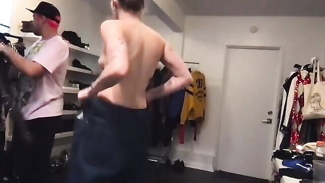 Miley Cyrus topless skinny back view pulling down pants in strip tease