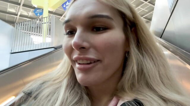 Hot blonde Czech babe with tattoos on escalator in airport