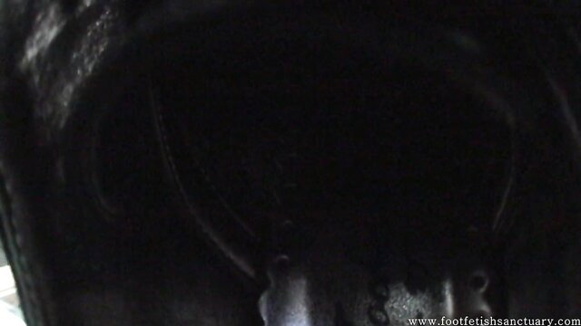 Close-up of stinky sweaty feet in boots for kinky foot fetish worship