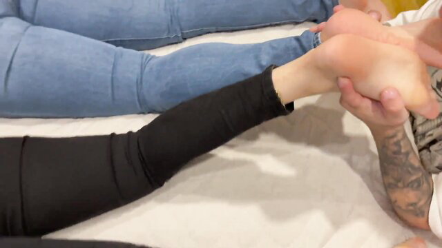 Goddess Grazi foot worship: tattooed man licks soles in kinky fetish