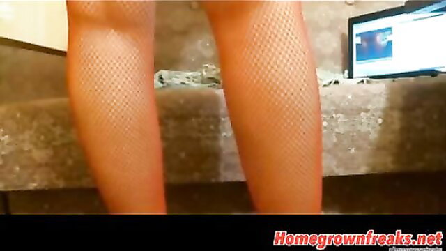 Closeup of woman's huge fishnet-clad ass cheeks in steamy anal tease