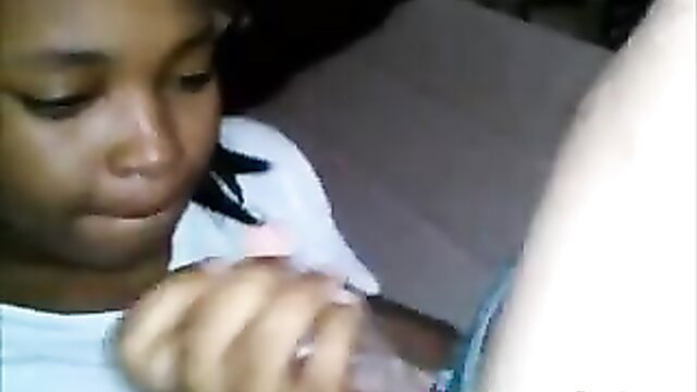 Innocent-faced black teen girl sucking cock closeup in amateur video