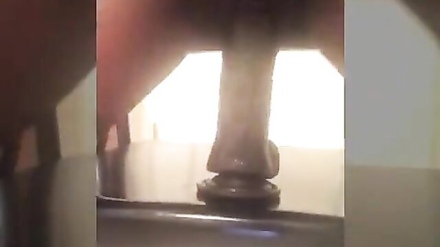 Naughty MILF's closeup kinky solo play with ebony dildo on table