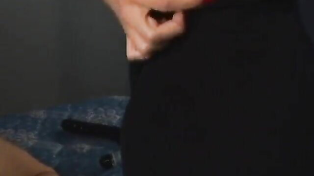 Group strapon femdom with woman in black dress gripping toy