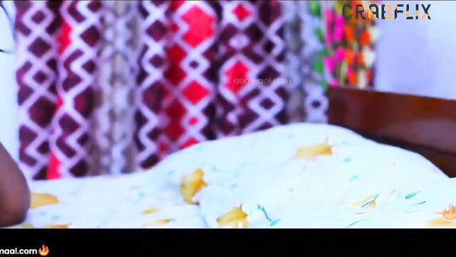 Hot Indian babe in colorful saree on bed, teasing cleavage