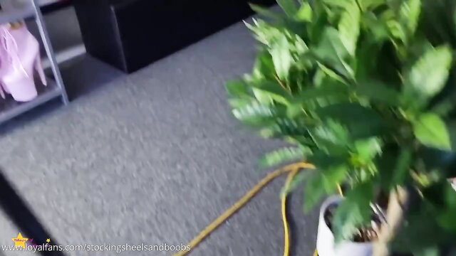 Blonde in pink high heels and lingerie solo tease by plants