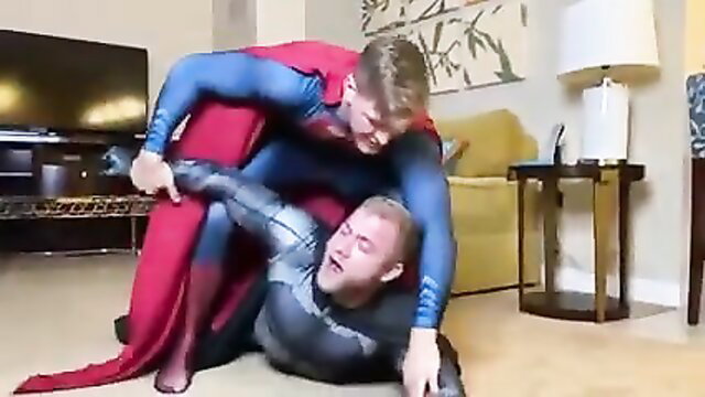 Superman wrestling Batman in tight spandex suits, gay superhero fight