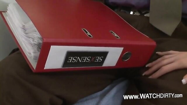 Cute babe with red SENSEX folder on lap in sexy office tease