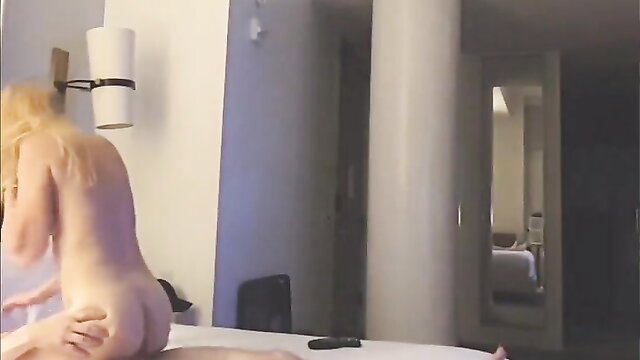 Blonde MILF nude from behind on bed, grabbing big ass in orgasm tease