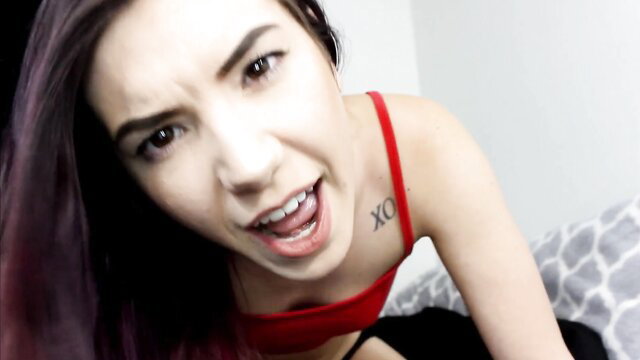 Marceline Leigh sticks out tongue in red bra, sexy closeup