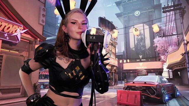 Blonde bunny girl in cyberpunk outfit blows kiss with headphones, Magik Ear Eating ASMR