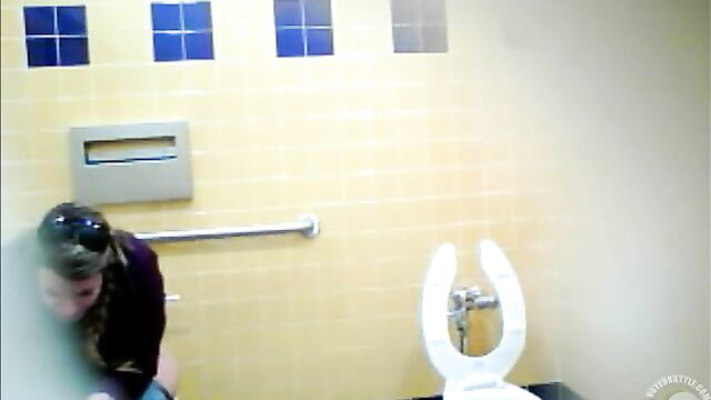 Pretty Mexican babe squatting to piss in public toilet