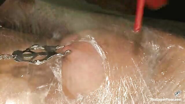 Rain DeGrey nipples clamped in bondage torture wrap