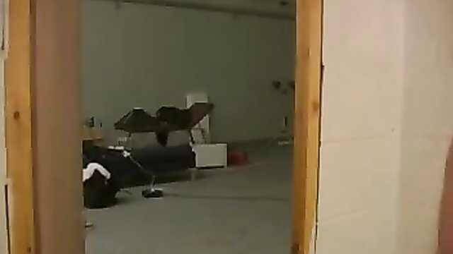 Traffic cop in uniform bent over table in Lethal Lipstick scene