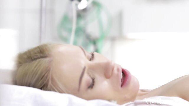 Blonde night nurse sleeping peacefully in hospital bed, softcore tease