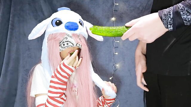 Cosplay girl in Stitch hat tricked with cucumber taste game by friend