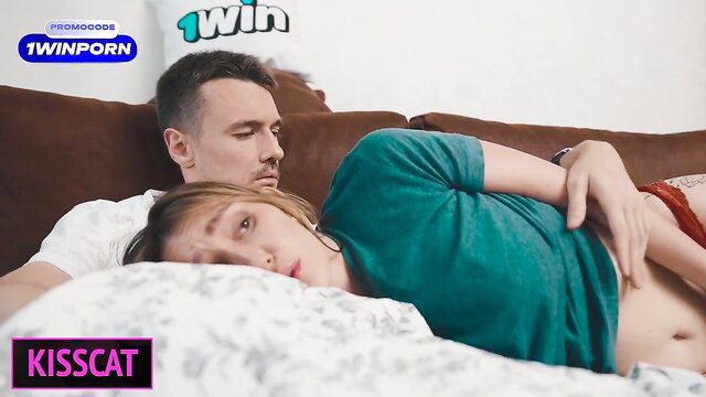 Busty blonde stepmom cuddles with stepson on bed in homemade vid