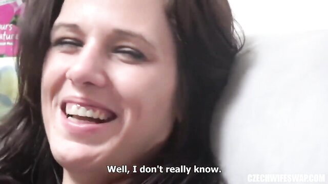 Smiling brunette wife laughs in amateur wife swap video thumbnail
