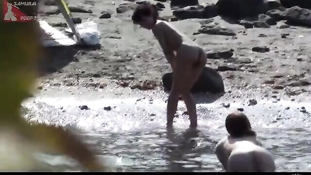 Naughty girls splash and pee on beach, nude asses exposed