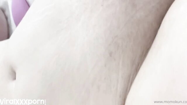 Momokun spreads pale thighs, tucks pink dildo deep in shaved pussy closeup