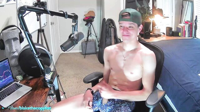 Shirtless twink Letsplayblake jerks off in swim trunks on stream