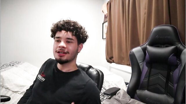 Curly-haired Latino guy smiling in bedroom, amateur blowjob tease