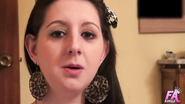 Brunette amateur babe with big leopard earrings talking to camera